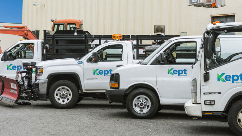 Line up of Kept Companies trucks